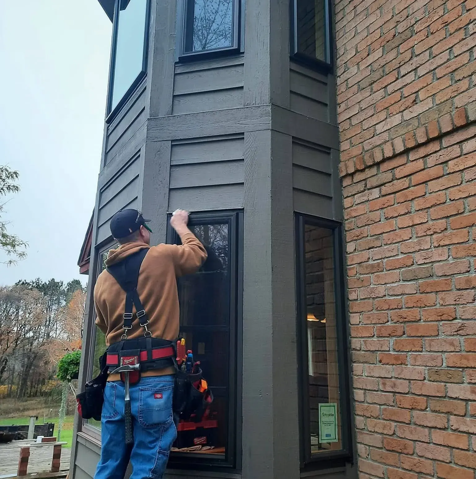 Kevin Preisler completing a window installation project